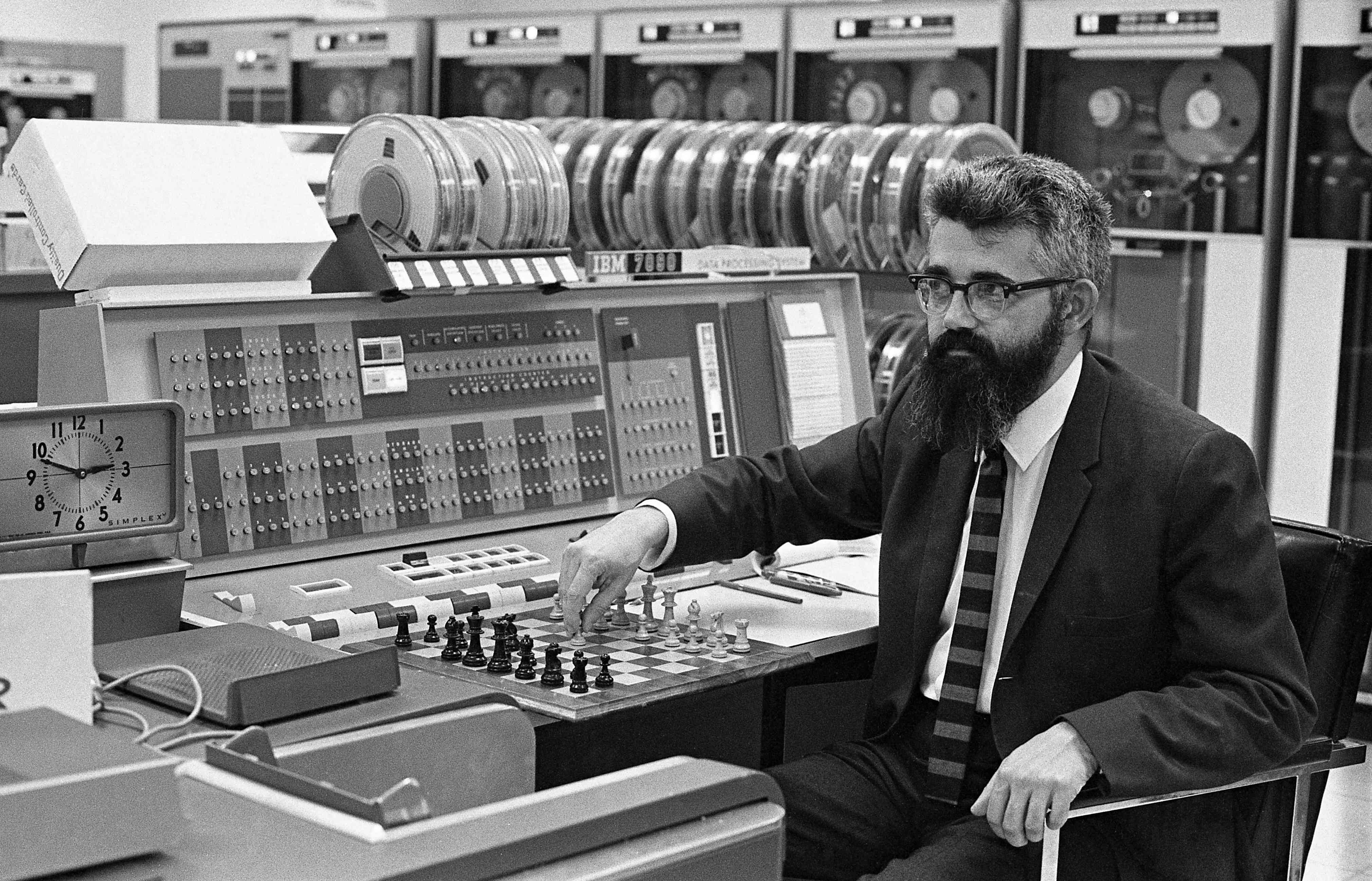 Preview of John McCarthy seated at a desk, playing computer chess