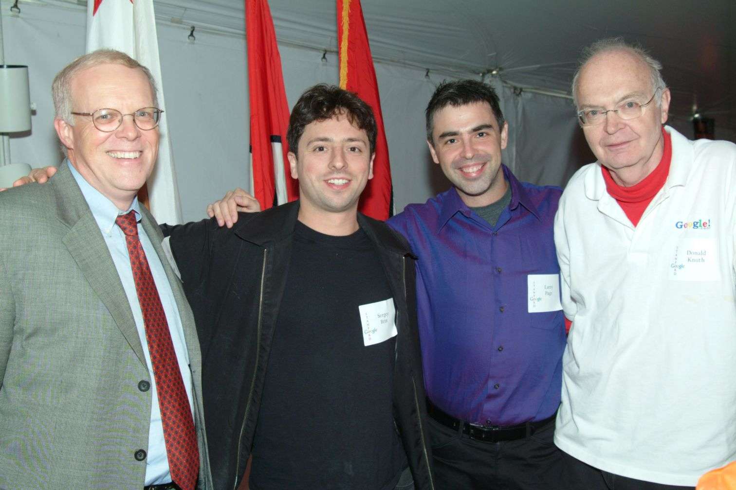 A group of men standing together posing for a photo.