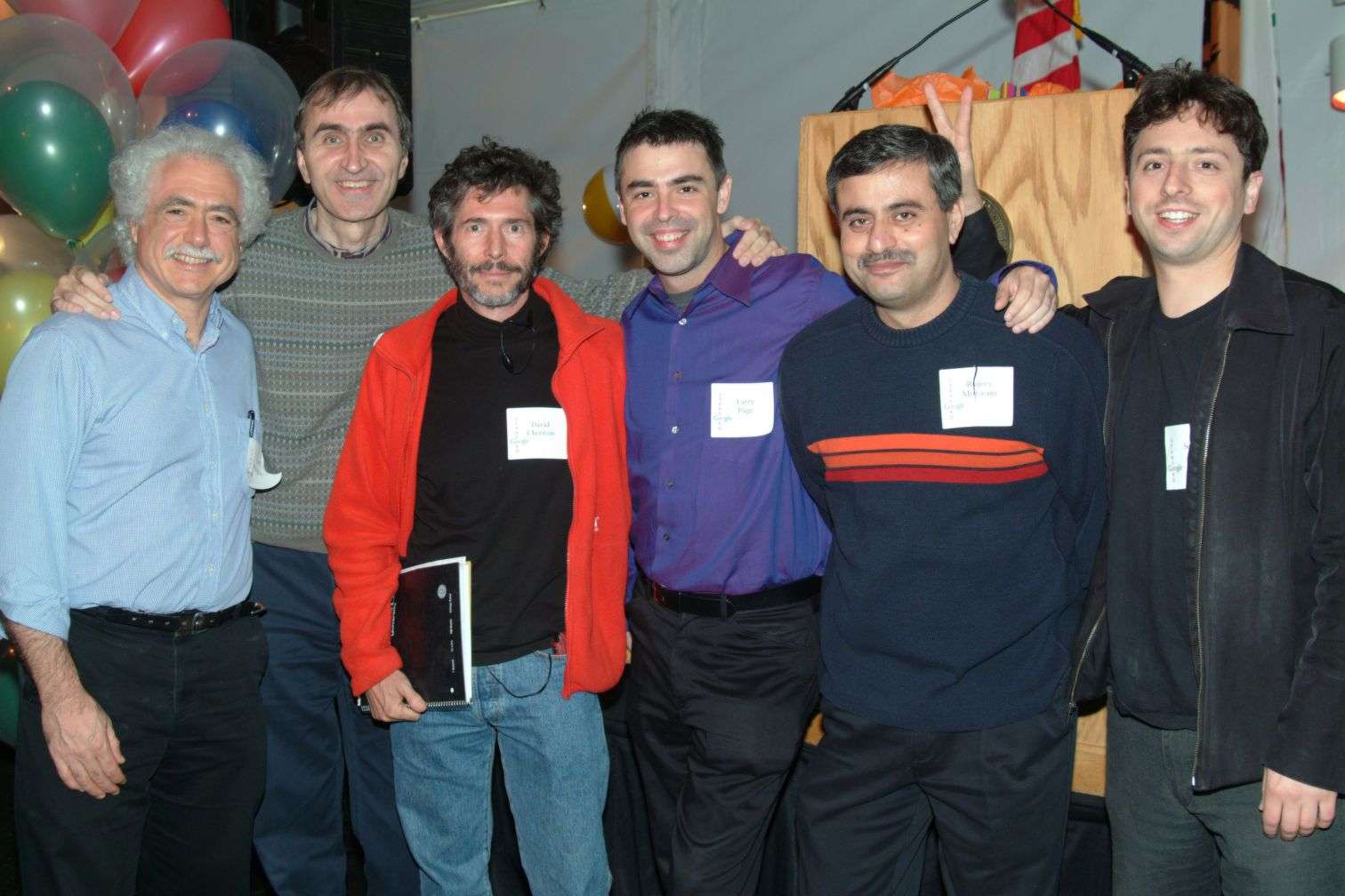 A group of men gathered together and posing for a photo.