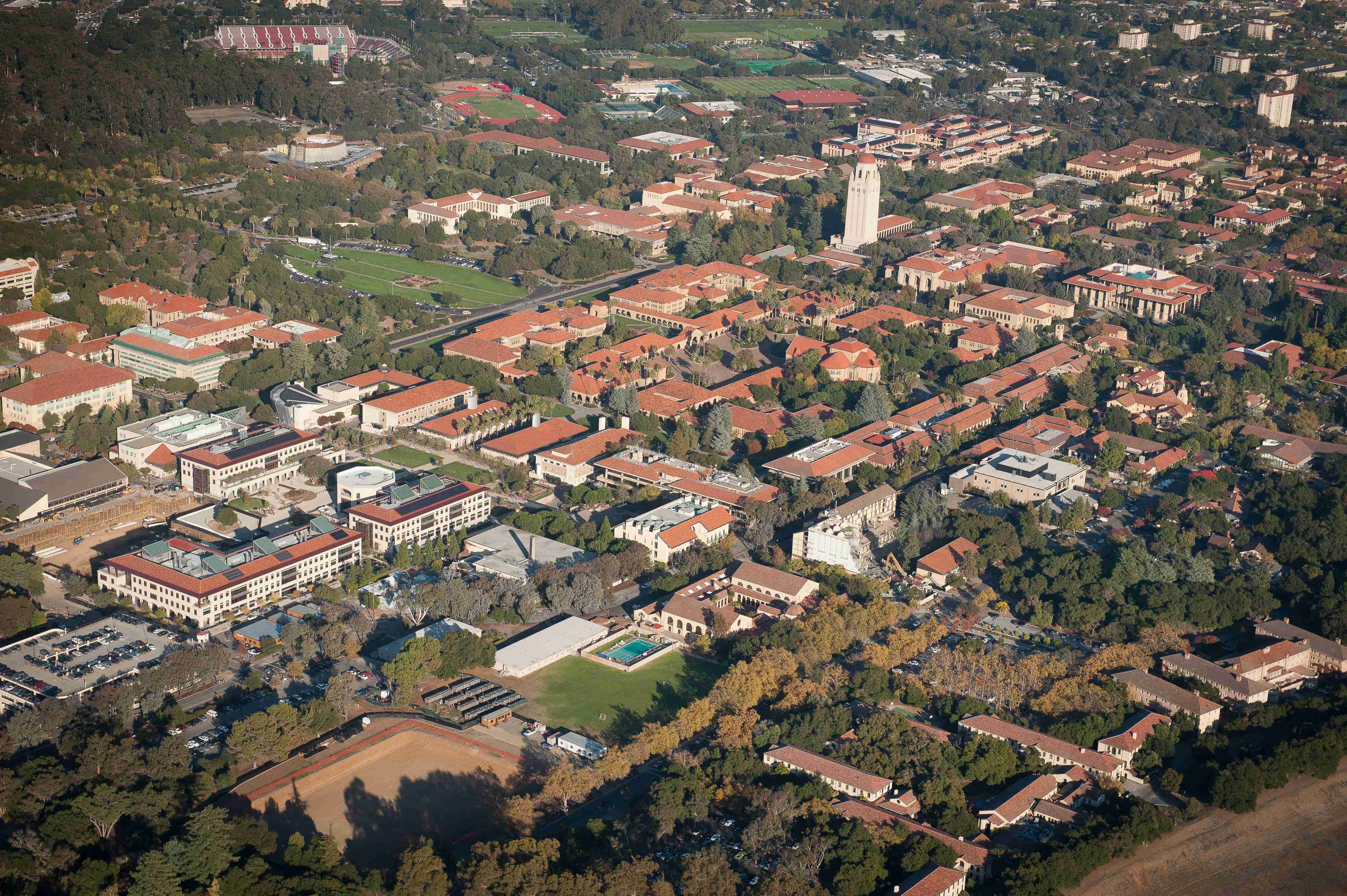 Aerial view of Stanford University's campus, showcasing its iconic architecture and lush green surroundings.