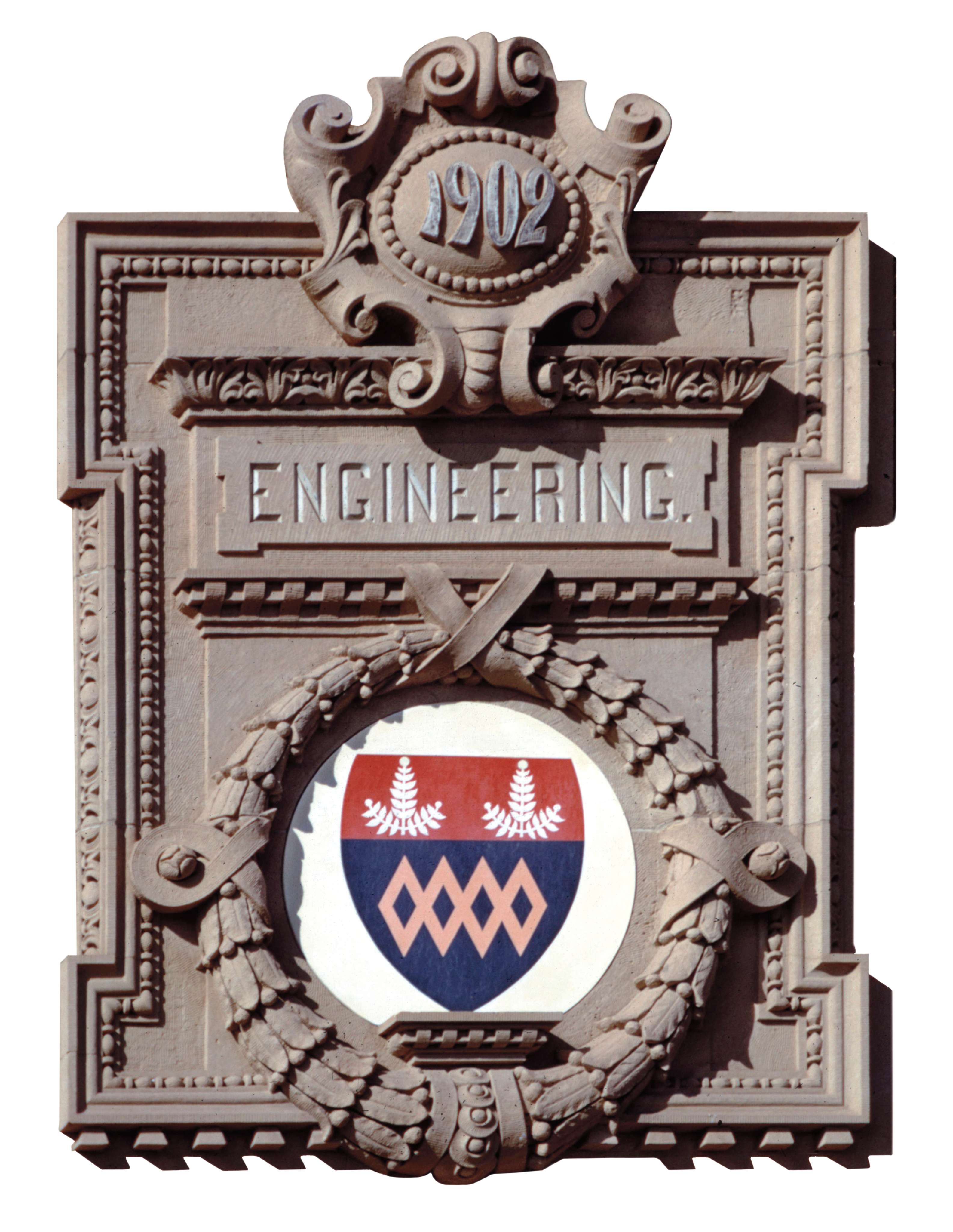 The words 1902 and engineering engraved into the side of the building along with the School of Engineering coat of arms.